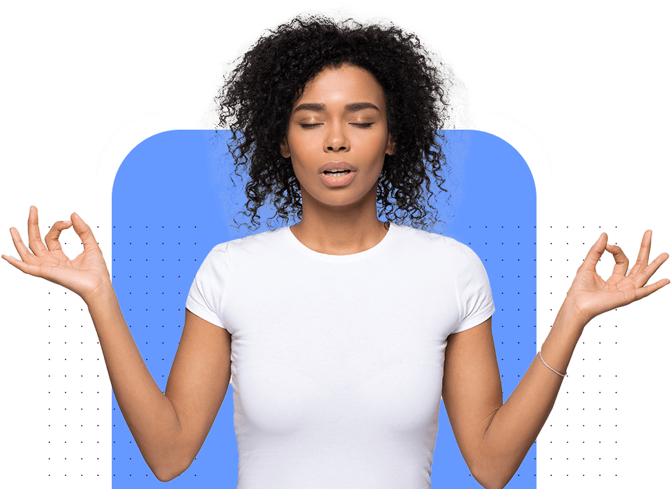 Woman sitting in a calm space while meditating.