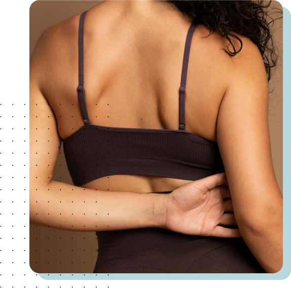 Dermatology 2 Back view of a woman showing smooth and glowing skin.